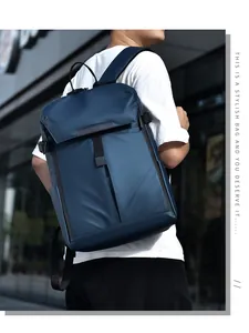 Side view of dark blue nylon business backpack featuring side straps and a mesh pocket