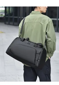 Detail view of large waterproof travel bag with adjustable shoulder strap and zippers