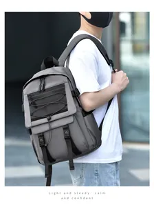 Detail view of large capacity dark grey backpack with adjustable straps and mesh layer