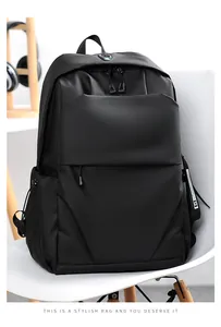 Detail view of black laptop backpack with textured fabric and multiple zipper compartments