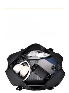 Top view of travel bag showing spacious interior for gadgets, clothes and toiletries