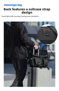 Detail of the messenger bag back strap secured to a suitcase for convenient travel