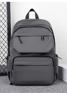 Close-up of waterproof grey multi-pocket backpack with durable zippers and D-ring detail
