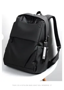 Detail of black business backpack with USB charging port and waterproof nylon texture
