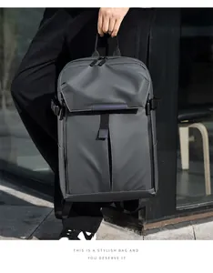 Detail of grey nylon travel backpack showing textured fabric and side buckle closure