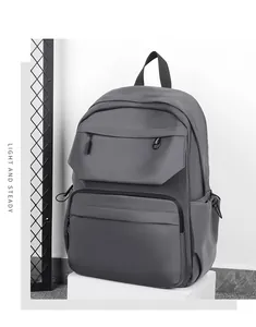 Detail view of water-resistant gray laptop backpack with multi-pocket and industrial design