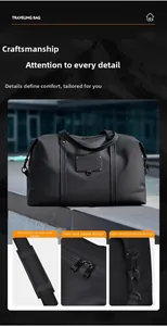 Detail view of the durable dual zippers and reinforced shoulder strap hooks on travel bag