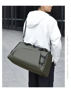 Detail of a dark green travel bag with water-resistant fabric and multiple compartments
