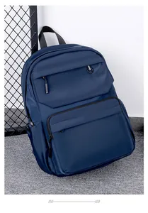 Detail of dark blue waterproof nylon backpack with reinforced handle and multi-layer zippers