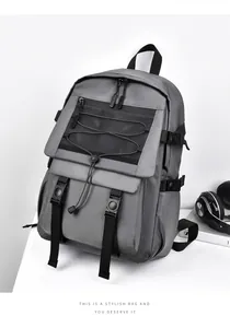 Detail view of the durable dark grey backpack with mesh pockets and adjustable straps