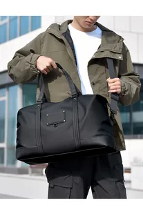Close-up of high-density waterproof nylon and leather details on large gym bag
