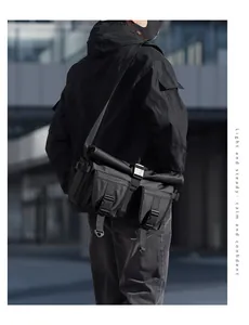 Side view of black tactical messenger bag featuring waterproof nylon and adjustable strap