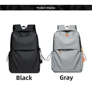 Detail of black and grey backpacks showing water-resistant nylon texture and drawstrings