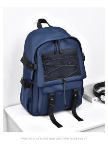 Detail of dark blue tactical backpack with side buckles, mesh pocket and bungee cords