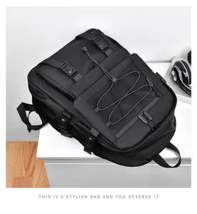 Detail of black tactical backpack with mesh pocket and elastic bungee cord straps