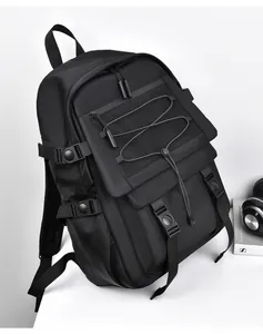 Detail of black tactical backpack featuring mesh pocket and adjustable side straps