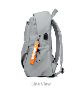 Side view of gray minimalist laptop backpack featuring orange strap and external USB port