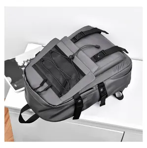 Macro shot of grey waterproof backpack with front mesh pocket and adjustable side buckles
