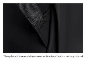 Close-up of triangle-reinforced stitching on shoulder straps for durable black backpack