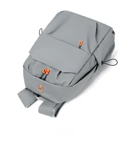 Detail of gray waterproof laptop backpack featuring orange zippers and breathable mesh straps
