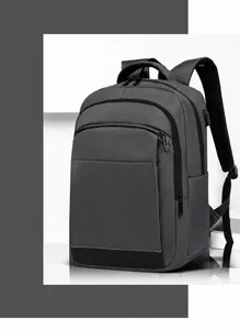 Detail showing high-capacity business backpack with waterproof fabric and dual front pockets