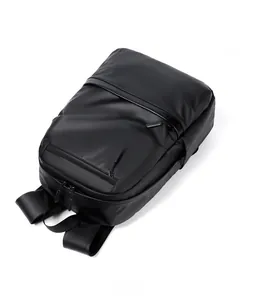 Top view detail of the black business laptop backpack showing reinforced handles and zippers