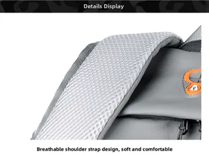 Close-up of breathable mesh shoulder strap with built-in charging port on gray backpack