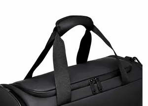 Detail of waterproof travel bag with reinforced handles and dual metal zippers
