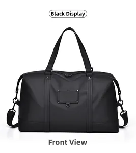Front view of black waterproof travel bag with reinforced handles and removable shoulder strap