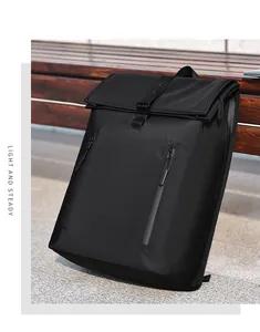 Detail of waterproof front zippers and leather buckle on black folding flap backpack