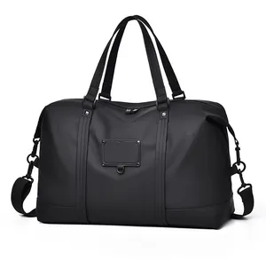 Close-up of durable black travel bag with matte metal hardware and water-resistant fabric
