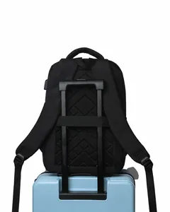 Detail of laptop backpack with luggage strap secured on a suitcase for business travel