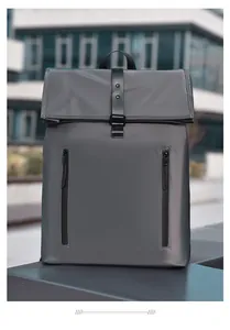 Detail of waterproof grey backpack with flap closure and dual vertical zippers