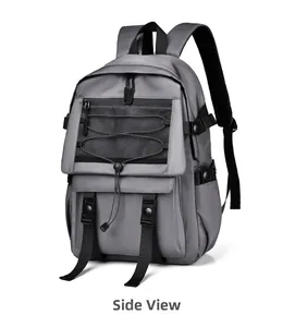 Side view of grey backpack with mesh pocket, black buckles, and elastic cord details