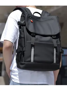Detail of waterproof black backpack with safety reflective strips and orange zipper accents