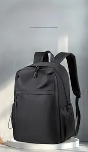Detailed view of black minimalist backpack with breathable mesh straps and dual zippers