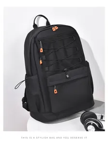 Close-up of durable black backpack with orange zipper accents and functional mesh pockets