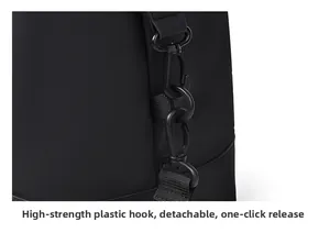 Macro view of high-strength detachable plastic hooks on black water-resistant travel bag