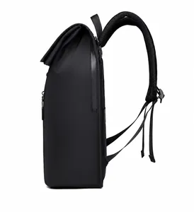 Side view of black business backpack showing waterproof fabric and ergonomic shoulder straps