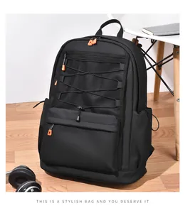 Detail of waterproof nylon backpack with orange zipper pulls and mesh pockets