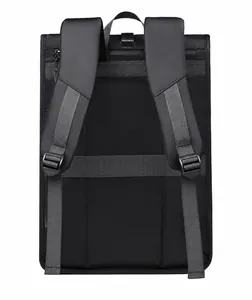 Padded shoulder straps and luggage strap on back of matte black business backpack