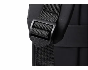 Macro shot of adjustable plastic buckle and durable nylon strap on black backpack