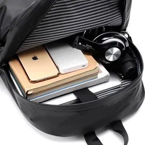 Men's minimalist black business backpack showing large capacity and laptop compartment