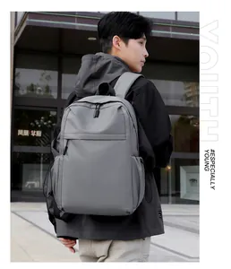 Side view of matte grey urban backpack featuring durable nylon fabric and padded shoulder straps