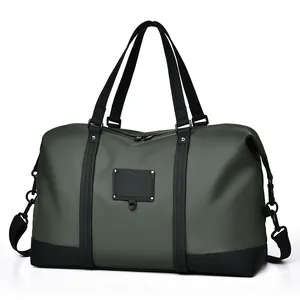 Waterproof travel duffel bag in olive green and black for gym and business travel