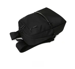 Detailed side view of black business backpack with breathable mesh straps and matte fabric