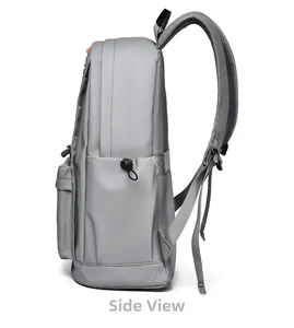 Side view of grey laptop backpack showing thick padded straps and drawstring side pocket