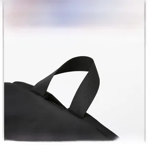 Close-up of the reinforced black padded handle on the large capacity laptop backpack