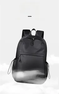 Detail of lightweight black nylon backpack showing zippers and drawstring side pockets
