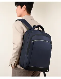 Detail view of large navy backpack featuring silver reflective safety strip and side pocket